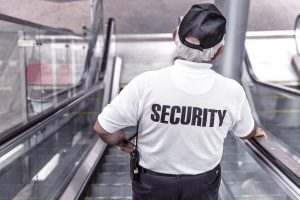 Security guard on an escalator